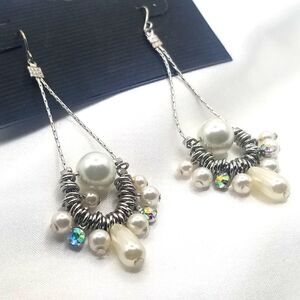 Silver toned long Dangle  beautiful unique Flux pearl and rhinestone earrings.
